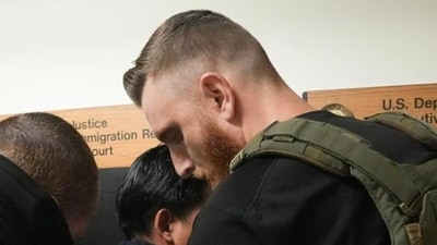An immigrant is detained by ICE agents in New York. An immigrant is detained by ICE agents in New York.