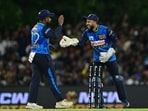 Sri Lanka's Kusal Mendis (R) celebrates with his captain Charith Asalanka after a dismissal.