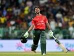 Tanzid Hasan celebrates after Bangladesh won by 8 wickets during the third and final Twenty20 international cricket match between Sri Lanka and Bangladesh