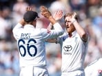 Ben Stokes celebrates with Joe Root after taking the wicket of India's Nitish Kumar Reddy.