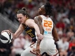 Indiana Fever guard Caitlin Clark (22) tries to get past Connecticut Sun guard Saniya Rivers (22) Indiana Fever guard Caitlin Clark (22) tries to get past Connecticut Sun guard Saniya Rivers (22)