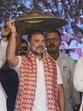 Congress leader Rahul Gandhi receives an Assamese Japi, a traditional headgear, during a party worker's meeting in Bangaon, west of Guwahati, on Wednesday. (AP) Congress leader Rahul Gandhi receives an Assamese Japi, a traditional headgear, during a party worker's meeting in Bangaon, west of Guwahati, on Wednesday. (AP)