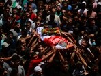 People carry the body of Sayfollah Kamel Musallet, a Palestinian-American man who was beaten to death by settlers, 