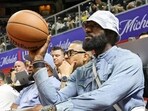 LeBron James of the Los Angeles Lakers throws the ball back to a referee as he attends a 2025 NBA Summer League game 