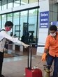 Pune, India - May 29, 2020:Passengers get their luggage sanitized and get thermal check up and show the registered Arogya sethu app ahead of boarding the flight at Pune International Airport in Pune, India, on Friday, May 29, 2020. (Photo by Shankar Narayan/HT PHOTO) Pune, India - May 29, 2020:Passengers get their luggage sanitized and get thermal check up and show the registered Arogya sethu app ahead of boarding the flight at Pune International Airport in Pune, India, on Friday, May 29, 2020. (Photo by Shankar Narayan/HT PHOTO)