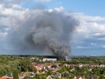 Smoke caused by a fire billows above the site of the Tomorrowland electronic music festival in Boom, northern Belgium on July 16, 2025. (Photo by Tom Goyvaerts / Belga / AFP) / Belgium OUT Smoke caused by a fire billows above the site of the Tomorrowland electronic music festival in Boom, northern Belgium on July 16, 2025. (Photo by Tom Goyvaerts / Belga / AFP) / Belgium OUT