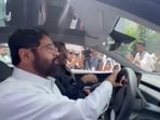 Eknath Shinde takes a Tesla car for a test drive outside the Mumbai Assembly.