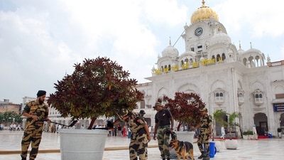 Security personnel with a sniffer dog frisk the surroundings of the Golden Temple in the wake of a fifth bomb threat, in Amritsar on Wednesday. (Raminder Pal Singh/ANI) Security personnel with a sniffer dog frisk the surroundings of the Golden Temple in the wake of a fifth bomb threat, in Amritsar on Wednesday. (Raminder Pal Singh/ANI)