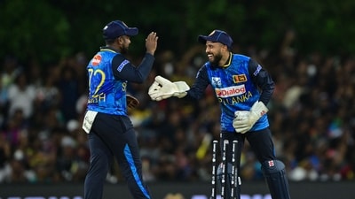 Sri Lanka's Kusal Mendis (R) celebrates with his captain Charith Asalanka after a dismissal. (AFP)