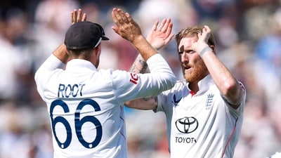 Ben Stokes celebrates with Joe Root after taking the wicket of India's Nitish Kumar Reddy. (Reuters)