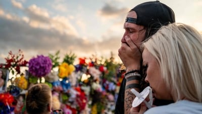 A couple weeps tears of sorrow at a candlelight vigil, that was held for honoring the lives that were lost in the deadly flash floods that battered USA's Texas from July 4. (Brandon Bell/AFP) A couple weeps tears of sorrow at a candlelight vigil, that was held for honoring the lives that were lost in the deadly flash floods that battered USA's Texas from July 4. (Brandon Bell/AFP)