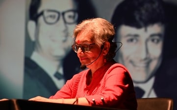Sohaila Kapur giving an audio-visual presentation on the lives of her uncles Dev Anand, Chetan Anand, and Vijay Anand