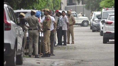 Punjab Police personnel deployed near the residence of SAD leader Bikram Singh Majithia at Green Avenue in Amritsar on Wednesday. (Sameer Sehgal/HT)