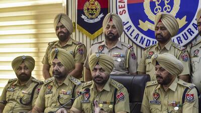 Senior Superintendent of Police (SSP) Harvinder Singh (seated third from left) addressing a press conference in Jalandhar on Wednesday regarding the arrest of a Canada-based NRI, who drove the SUV that hit Fauja Singh, on Monday leading to the death of the centenarian marathon runner. (PTI Photo) Senior Superintendent of Police (SSP) Harvinder Singh (seated third from left) addressing a press conference in Jalandhar on Wednesday regarding the arrest of a Canada-based NRI, who drove the SUV that hit Fauja Singh, on Monday leading to the death of the centenarian marathon runner. (PTI Photo)