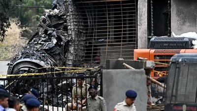 Police stand guard near the debris of Air India flight 171 after it crashed in a residential area near the airport in Ahmedabad on June 12. (AFP/File)