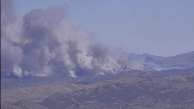 The fire is around 15 miles outside the military base (X) The fire is around 15 miles outside the military base (X)