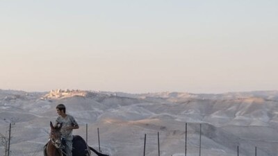 The remains of an Iranian missile lie near an Israeli settlement in the West Bank in the aftermath of the war. The remains of an Iranian missile lie near an Israeli settlement in the West Bank in the aftermath of the war.