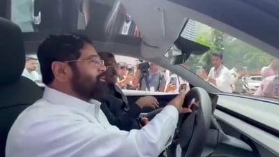 Eknath Shinde takes a Tesla car for a test drive outside the Mumbai Assembly. (Screengrab/@PTI_News) Eknath Shinde takes a Tesla car for a test drive outside the Mumbai Assembly. (Screengrab/@PTI_News)