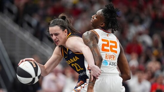 Indiana Fever guard Caitlin Clark (22) tries to get past Connecticut Sun guard Saniya Rivers (22) (AP)