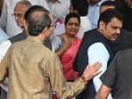 Uddhav Thackeray (back to camera) interacting with CM Devendra Fadanvis during a photoshoot at a farewell function for the leader of opposition in the legislative council, Amabdas Danve, on Wednesday, July 16. Uddhav Thackeray (back to camera) interacting with CM Devendra Fadanvis during a photoshoot at a farewell function for the leader of opposition in the legislative council, Amabdas Danve, on Wednesday, July 16.