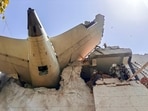 The remains of an Air India plane that crashed moments after taking off from Sardar Vallabhbhai Patel International Airport lie on a building in Ahmedabad. The first investigation report into the crash has revealed that both switches feeding fuel to the two engines of Air India flight 171 were cut off, followed by pilot confusion, before the plane crashed in Ahmedabad seconds after taking off.