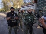 Syrian Bedouin fighters gather with weapons, as they launch a new offensive in Sweida province against Druze fighters despite a truce. 