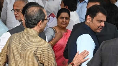 Uddhav Thackeray (back to camera) interacting with CM Devendra Fadanvis during a photoshoot at a farewell function for the leader of opposition in the legislative council, Amabdas Danve, on Wednesday, July 16. (Raju Shinde/HT Photo) Uddhav Thackeray (back to camera) interacting with CM Devendra Fadanvis during a photoshoot at a farewell function for the leader of opposition in the legislative council, Amabdas Danve, on Wednesday, July 16. (Raju Shinde/HT Photo)