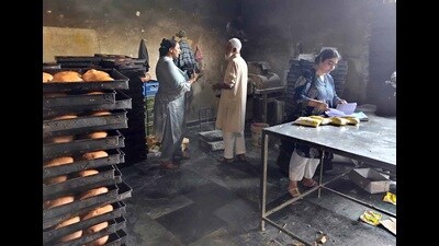 Health officials during a surprise check at a bakery unit in Ludhiana on Thursday. (HT Photo)