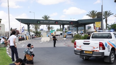 People gather at the entrance of Ben Gurion Airport, following a missile attack launched from Yemen, in Tel Aviv, Israel, May 4, 2025. (Reuters)