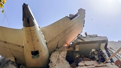 The remains of an Air India plane that crashed moments after taking off from Sardar Vallabhbhai Patel International Airport lie on a building in Ahmedabad. The first investigation report into the crash has revealed that both switches feeding fuel to the two engines of Air India flight 171 were cut off, followed by pilot confusion, before the plane crashed in Ahmedabad seconds after taking off. (CISF/X)