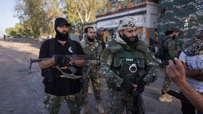 Syrian Bedouin fighters gather with weapons, as they launch a new offensive in Sweida province against Druze fighters despite a truce. (Reuters)