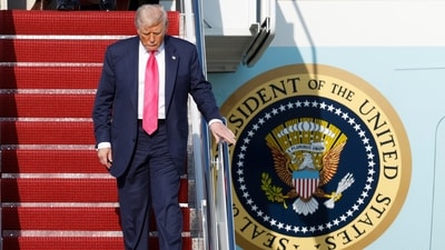 Donald Trump walks down the stairs of Air Force One upon his arrival at Joint Base Andrews, Md., Tuesday, July 15 (AP)