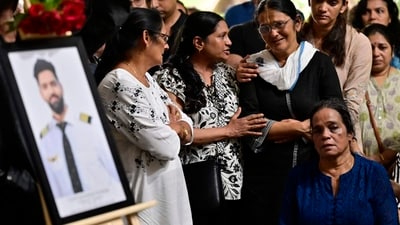 Relatives and friends of pilot Clive Kunder at his funeral last month. Relatives and friends of pilot Clive Kunder at his funeral last month.