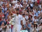 Novak Djokovic waves to Wimbledon's Centre Court after his loss to Jannik Sinner.