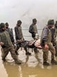 Army personnel rescue a pilgrim stranded due to heavy rainfall and landslides during the annual Amarnath Yatra, in Jammu and Kashmir. (PTI) Army personnel rescue a pilgrim stranded due to heavy rainfall and landslides during the annual Amarnath Yatra, in Jammu and Kashmir. (PTI)