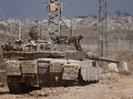 An Israeli tank stands on the Israel-Gaza border, amid the ongoing conflict between Israel and Hamas.