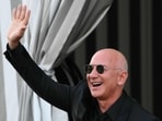 Jeff Bezos reportedly has a hedge fence at his Beverly Hills estate that may violate local zoning laws. (Photo by Marco BERTORELLO / AFP)