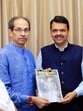 Shiv Sena (UBT) Chief Uddhav Thackeray presents the book 'Why Do You Want Hindi?' compiled by various editors across the state against the compulsory implementation of Hindi, to state Chief Minister Devendra Fadnavis, at Vidhan Bhavan in Mumbai on Thursday. (@ShivSenaUBT_ X/ANI Photo) (@ShivSenaUBT_ X) Shiv Sena (UBT) Chief Uddhav Thackeray presents the book 'Why Do You Want Hindi?' compiled by various editors across the state against the compulsory implementation of Hindi, to state Chief Minister Devendra Fadnavis, at Vidhan Bhavan in Mumbai on Thursday. (@ShivSenaUBT_ X/ANI Photo) (@ShivSenaUBT_ X)