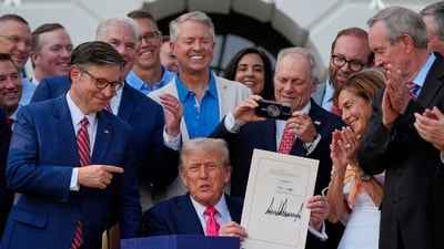 President Donald Trump holds his signed signature bill of tax breaks and spending cuts at the White House. (AP File) President Donald Trump holds his signed signature bill of tax breaks and spending cuts at the White House. (AP File)