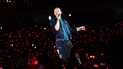 Chris Martin of the British rock band Coldplay performs onstage during a concert as part of their Music of the Spheres World Tour at the DY Patil stadium in Navi Mumbai on January 18, 2025. (AFP)