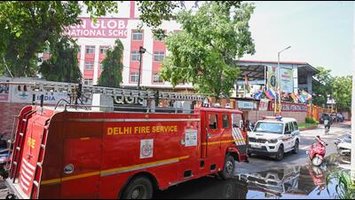 Delhi Police personnel and fire fighters conduct a security check at Queen Global International School in Dilshad Garden after the school received a bomb threat via email, in New Delhi on Friday. (Sonu Mehta/HT PHOTO) Delhi Police personnel and fire fighters conduct a security check at Queen Global International School in Dilshad Garden after the school received a bomb threat via email, in New Delhi on Friday. (Sonu Mehta/HT PHOTO)