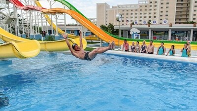 Domestic tourists watch as a man uses a slide into a swimming pool at the Myongsasimni Water Park in the Wonsan Kalma Coastal Tourist Area in Wonsan, North Korea's Kangwon Province (AFP) Domestic tourists watch as a man uses a slide into a swimming pool at the Myongsasimni Water Park in the Wonsan Kalma Coastal Tourist Area in Wonsan, North Korea's Kangwon Province (AFP)