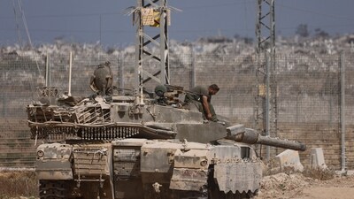 An Israeli tank stands on the Israel-Gaza border, amid the ongoing conflict between Israel and Hamas. (REUTERS File)