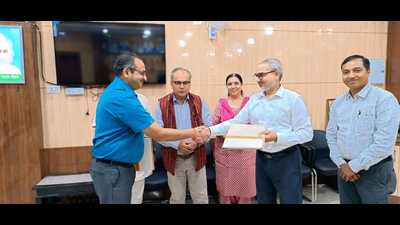 Officials from UPRTOU and UP Board at the MoU signing ceremony in Prayagraj on Friday. (HT PHOTO)
