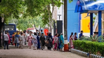 Staff members of the Navy Children School assemble in an area after a bomb threat at Chanakyapuri area, in New Delhi, Monday. (PTI) Staff members of the Navy Children School assemble in an area after a bomb threat at Chanakyapuri area, in New Delhi, Monday. (PTI)