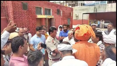 Police outside the Jind civil hospital where Rohtash Kumar’s (inset) autopsy was conducted on Friday. (HT File) Police outside the Jind civil hospital where Rohtash Kumar’s (inset) autopsy was conducted on Friday. (HT File)
