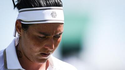 Tunisia's Ons Jabeur reacts as she plays against Bulgaria's Viktoriya Tomova during their Wimbledon encounter. (AFP) Tunisia's Ons Jabeur reacts as she plays against Bulgaria's Viktoriya Tomova during their Wimbledon encounter. (AFP)