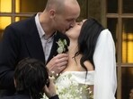 Instead of a traditional full-length wedding gown, Charli wore a short, off-shoulder white silk mini dress. Instead of a traditional full-length wedding gown, Charli wore a short, off-shoulder white silk mini dress.