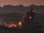 Smoke and fire rise to the sky following an Israeli airstrike in the northern Gaza Strip, as seen from southern Israel, Friday, July 18, 2025.