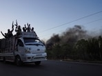 Bedouin fighters ride on a vehicle along a street as Sweida province has been engulfed by nearly a week of violence triggered by clashes between Bedouin fighters and factions from the Druze, at Sweida governorate, Syria, July 18, 2025.